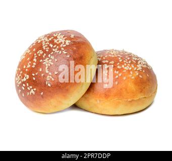 Whole round bun made of white wheat flour with sesame seeds isolated on white background Stock Photo