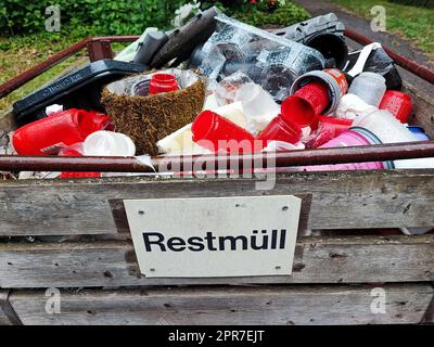 bins with residual waste for recycling in a cemetery Stock Photo