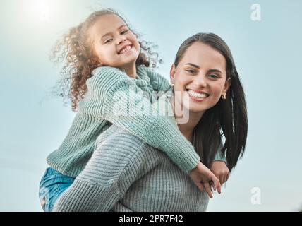 There is no more powerful love than one a parent. Shot of a little girl spending the day outdoors with her mother. Stock Photo