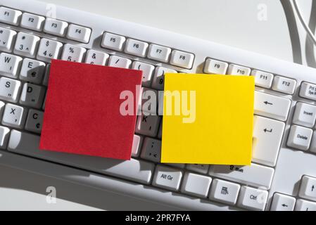 Important Messages Written On Two Notes On Desk Above Keyboard. Crutial Informations Presented On Different Memos On Office Table. Recent Updates Shown. Stock Photo