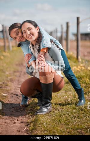 Come join us for a fun filled day at the ranch. a little girl and mother spending time together on a ranch. Stock Photo