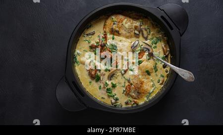 Creamy Italian Tuscan Chicken with Spinach and mushrooms, and sundried tomatoes Stock Photo