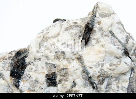 biotite mineral in a rock over white background Stock Photo