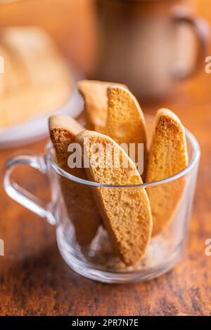 Sweet anicini cookies. Italian biscotti with anise flavor in cup on wooden table. Stock Photo