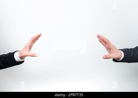 Important Message Presented Between Business Team Hands. Crutial Information Displayed Among Two Palms. Critical Announcements Shown From Man And Woman. Stock Photo