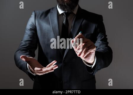 Businessman Holding Pen And Presenting Important Informations With One Hand And Showing Other Message Over Other. Man In Suit Showing Crutial Announcements With Pencil In Hand Stock Photo