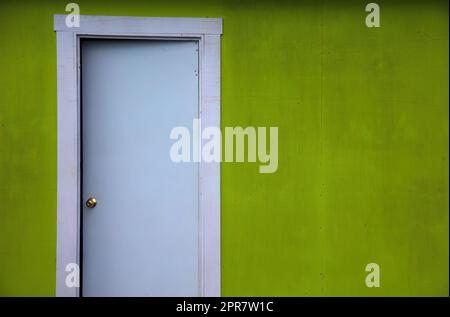 open door entrance bright green wall background exit solution choice Stock Photo