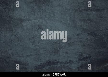 Gloomy black granite stone surface texture background Stock Photo
