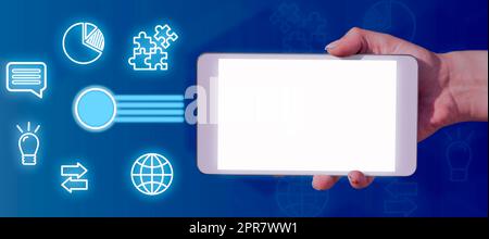 Businessman Holding A Tablet Showing The Power Button And Digital S In An Abstract Design. A Hand With Touch Screen Presenting Crucial Information And Applications. Stock Photo