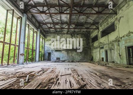 Abandoned ruined school gym in Pripyat Ukraine Stock Photo