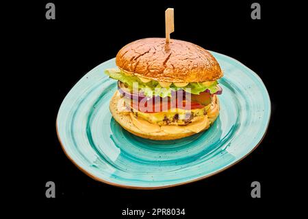 american cheeseburger isolated on a black background Stock Photo