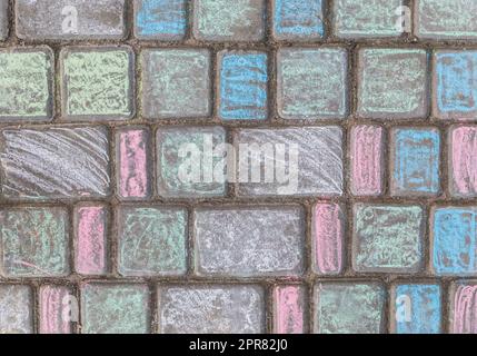 colorful paving slabs, which the children painted with chalk Stock Photo