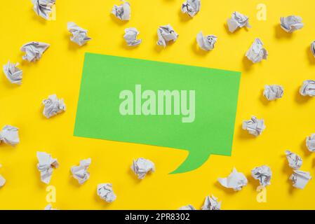 Paper Wraps Placed Around Speech Bubble With Important Information. Wrinkled Notes Arranged All Over Dialogue Ballon With Crutial Message. Crumpled Memos With Critical Data In Stock Photo