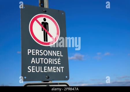 french authorized personnel only restricted area forbidden sign on blue sky Stock Photo