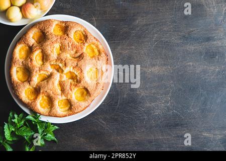 cake with apricots. Homemade delicious apricot cake with fresh apricots Stock Photo