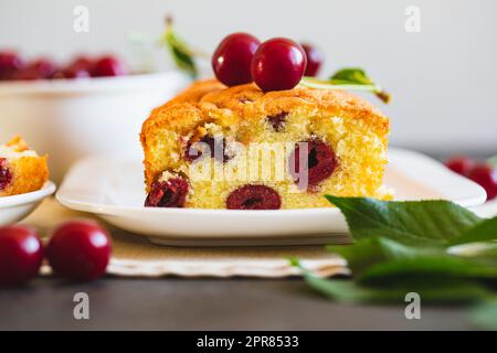 delicious sweet cake with cherries and a fresh cherry on the side. cherry pie Stock Photo