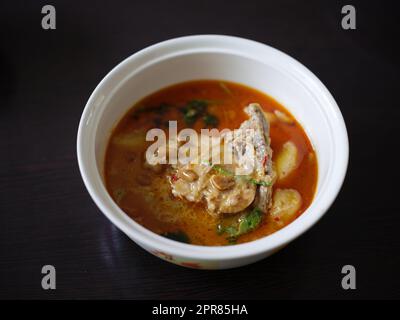 Chicken Mussaman Curry on white bowl Stock Photo