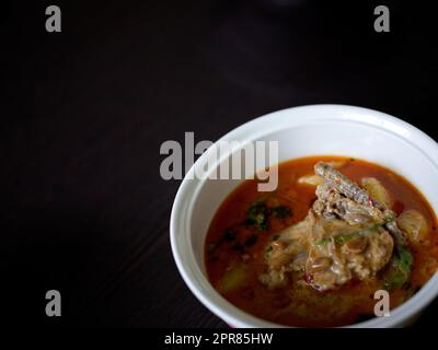 Chicken Mussaman Curry on white bowl Stock Photo