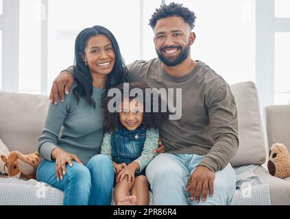 The memories we make with our family is everything. a happy family relaxing together at home. Stock Photo