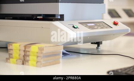 Printing machines in production for printing on packages. Work on a flatbed, large format inkjet UV printer. Large format printing press in operation. Industry. Stock Photo