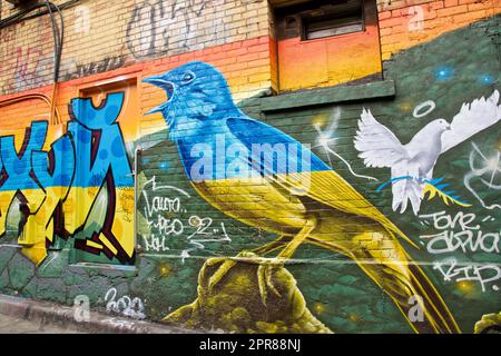 Toronto, Ontario / Canada - Sept. 24, 2022: Abstract colourful graffiti paintings on concrete walls.  Street art, background, texture. Stock Photo