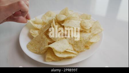 Having potato chip on plate Stock Photo