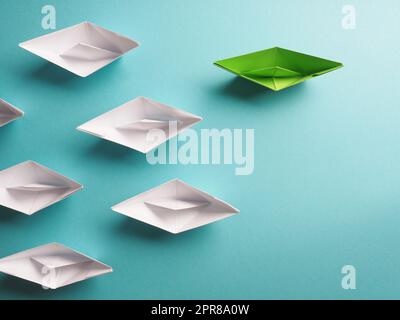 New ideas, creativity and various innovative solutions or leadership, ecology concept with paper boats Stock Photo