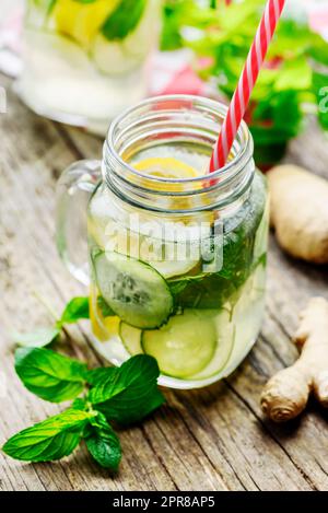 Lemon and cucumber drink in retro jars Stock Photo