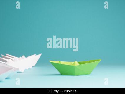 New ideas, creativity and various innovative solutions or leadership, ecology concept with paper boats Stock Photo