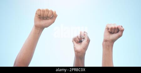 Do you realise how much power there is in numbers. Cape Town, South African - October 2, 2021 Unrecognisable demonstrators holding up their fists in protest. Stock Photo