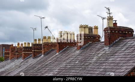 Clay chimney pots on rooftops Stock Photo