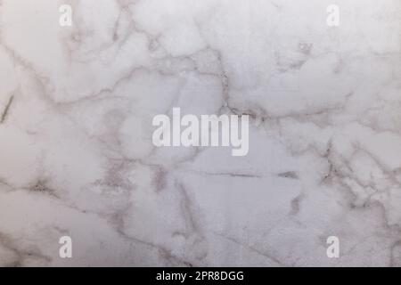 Marble textured stucco wall background with a messy decorative canvas pattern Stock Photo
