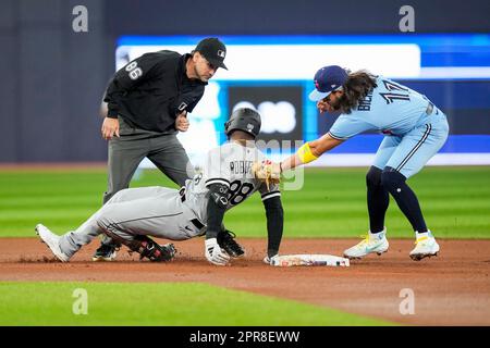 Chicago White Sox shortstop Luis Aparicio is still in air after firing ball  to first base