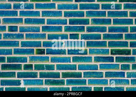 Background from a wall made of turquoise bricks Stock Photo