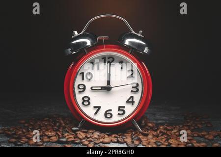 front view of brown coffee seeds with clocks on dark background grain group Stock Photo