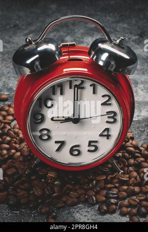 front view of brown coffee seeds with clocks dark background textured grain group Stock Photo