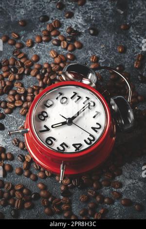 front view of brown coffee seeds with red clocks dark surface group cocoa grain Stock Photo