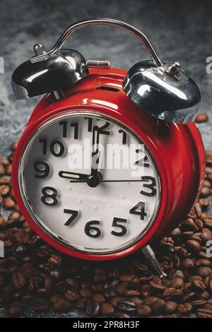 front view of brown coffee seeds with red clocks dark surface group grain textured Stock Photo