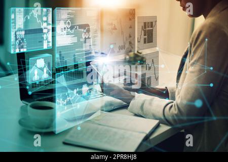 Hard work always pays off. a businesswoman using a mobile phone and laptop with graphs on it in a modern office. Stock Photo