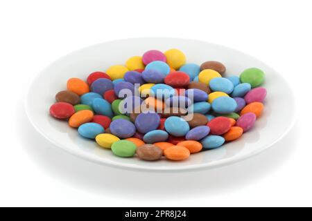 Multi coloured halloween candy sweets on a plate Stock Photo