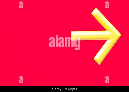 A photo of a yellow arrow on a red background indicating the direction to go somewhere Stock Photo