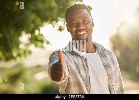 Mother nature provides. a young man giving a thumbs up on a farm. Stock Photo