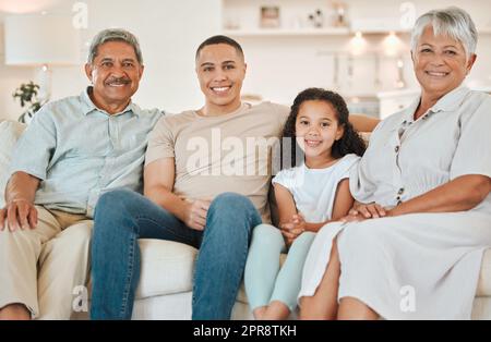 Typical Sundays. a beautiful family bonding on a sofa at home. Stock Photo