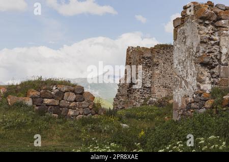 Akhalkalaki castle ruins of an medieval watchtowers with Didi Abuli Mountain, dormant volcano, in the background, Georgia. Stock Photo