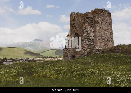 Akhalkalaki castle ruins of an medieval watchtower with Akhalkalaki town and Didi Abuli Mountain, dormant volcano, in the background, Georgia. Stock Photo