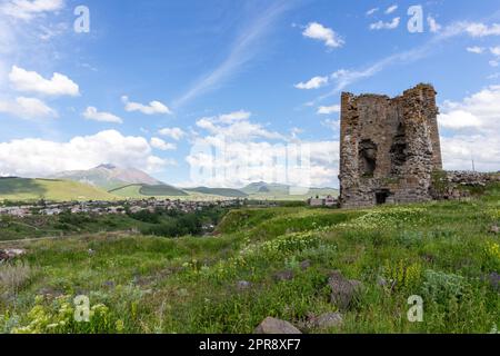 Akhalkalaki castle ruins of an medieval watchtower with Akhalkalaki town and Didi Abuli Mountain, dormant volcano, in the background, Georgia. Stock Photo