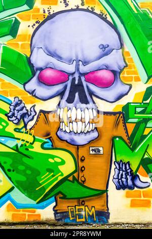 Dressed human skeleton with large skull creative graffiti urban street art in Sofia, Bulgaria, Eastern Europe, Balkans, EU Stock Photo