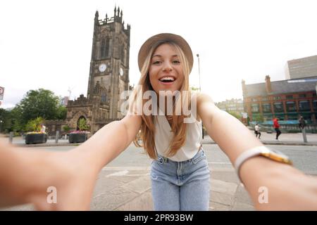 Attractive young woman takes self portrait in Manchester, England, United Kingdom Stock Photo
