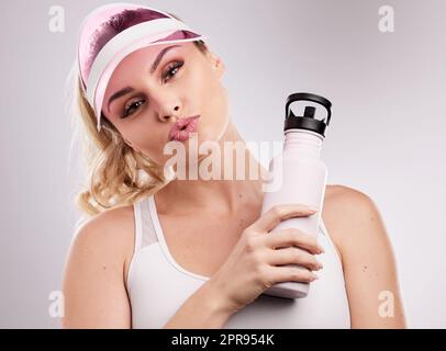 Some girls are just born with glitter in their veins. Studio shot of a sporty young woman posing against a grey background. Stock Photo