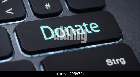 Illuminated keyboard with a labeled key - Donate Stock Photo